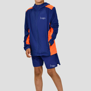 Conjunto Deportivo de Dos Piezas Personalizado OEM, Chaqueta Cortavientos con Cierre de 1/4 y Pantalones Cortos de Nailon Unisex para Hombre - Product Image 1