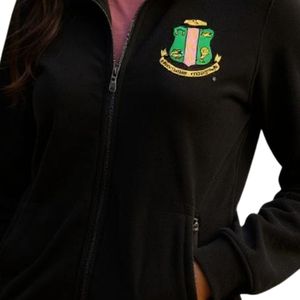 Chaqueta de microforro polar negra para mujer con cremallera completa, parche de escudo verde y dorado, manga larga, cálida, informal, para exteriores, suave y cómoda. - Product Image 3