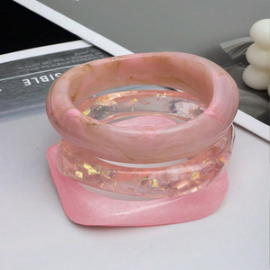 Crystal <b>clear</b> <b>resin</b> bangles infused with fine silver glitter shimmer and tiny star sequins, available at wholesale prices. - Product Image 4