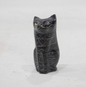 Small hand-carved dark soapstone cat figurine with delicate geometric etchings, available at wholesale prices. - Product Image 1