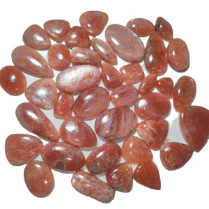 พลอยซันสโตนสีส้มธรรมชาติคุณภาพสูง ขัดเงา รูปทรงหลังเบี้ย สำหรับทำเครื่องประดับ รับรองโดย KHUSHI GEMS STONE ผู้เชี่ยวชาญด้านอัญมณี - Product Image 1