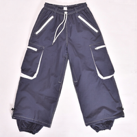 Pantalon de neige noir élégant avec bordure blanche, imprimé, coupe-vent, imperméable, grandes poches cargo, fermetures éclair ventilées, cordon de serrage, coupe ajustée, isolation thermique