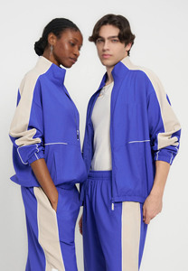 Unisex Polyester Tracksuits <b>Patchwork</b> Zip up Nylon <b>Jacket</b> and Pants Jogger Gym Sets Custom Tracksuit Unisex Oem Nylon Track Suit - Product Image 4