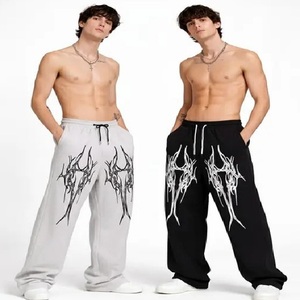 Pantalon de survêtement ample noir et blanc pour homme, en coton, coupe oversize, imprimé tribal, style streetwear, avec taille élastique et cordon de serrage - Product Image 6