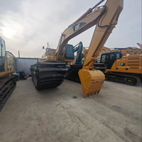 Excavatrice sur chenilles amphibie d'occasion CAT 320CL, modèle original Caterpillar 320CL, pour travaux en zone humide
