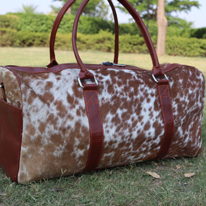 Premium cowhide leather hair on travel <b>bags</b> wholesale supplier OEM custom logo handmade export fashion luggage <b>bags</b> for sale - Product Image 3