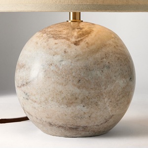 Solución de iluminación para mesa de piedra refinada que ofrece una geometría redondeada artística, artesanía de primera calidad e iluminación ambiental suave. - Product Image 4