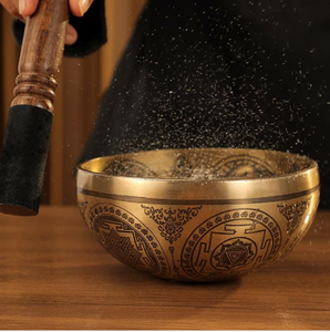 Brass singing bowl with polished golden rim and engraved Dharma wheel symbol on the exterior, available at wholesale prices. - Product Image 3