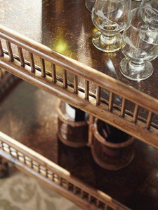 Modern Rattan Two-Tiered Black and Gold Hotel Serving <b>Table</b> with Four Swivel Wheels and Wine Rack - Product Image 2
