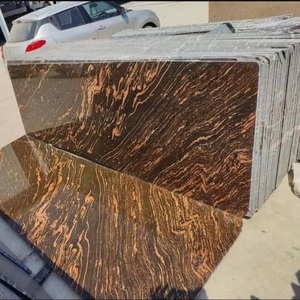 Dalles et blocs de granit doré poli, idéaux pour les projets de construction haut de gamme, les surfaces de cuisine et les intérieurs commerciaux - Product Image 1