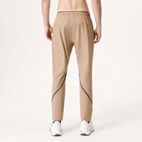 Haute qualité 90% Nylon 10% Spandex séchage rapide extensible résistant à l'eau athlétique actif course entraînement Gym survêtement pantalon pour hommes