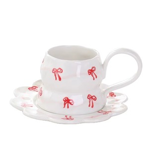 Mug en céramique haut de gamme avec un adorable motif nœud papillon et soucoupe pour un plaisir quotidien du café, magnifiquement conçu par KRAFT WORLD - Product Image 1