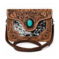Sac bandoulière artisanal en cuir de vachette à poils, style western, motif floral, accent turquoise, sangle réglable, pour femme