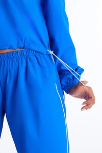 High Quality OEM Sportswear <b>Women</b> <b>Windbreaker</b> Tracksuit Solid Lightweight Nylon Printed Tracksuits Set - Product Image 5
