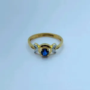 Exquisite 22K Gold <b>Statement</b> <b>Ring</b> for Women Featuring a Brilliant Oval-Cut Blue Sapphire Gemstone Butterfly Wing Accents - Product Image 1