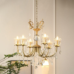 Lustre doré sophistiqué mettant en valeur des accents en céramique vert pâle et des abat-jour en tissu crème effilé, au prix de gros. - Product Image 4