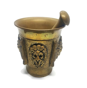 Detailed lion face relief vintage brass mortar and pestle set for home display, available at wholesale prices. - Product Image 1