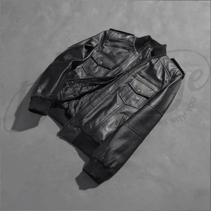 Sleek black genuine <b>leather</b> construction featuring a utility pocket and a traditional ribbed baseball collar. - Product Image 2