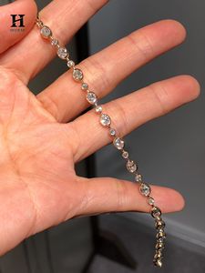 Pulsera de tenis con diamantes ovalados y redondos engastados en bisel, de oro de 14K, con cadena de eslabones y múltiples piedras alternadas. - Product Image 3