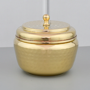 Lovely hand-painted brass ghee <b>pot</b> adorned with vibrant floral leaf motifs and a matching spoon. Available at wholesale price. - Product Image 5