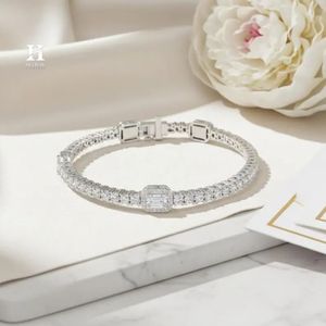 Exquisite Gold Tennis <b>Bracelet</b> Featuring Emerald Cut Centerpiece and Round Diamond Halo - Product Image 3
