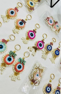 Ensemble de porte-clés Nazar Rakhi élégant fait main avec des pompons de perles et un charme Shubh Labh pour des cadeaux festifs, ensemble de porte-clés artisanal - Product Image 2