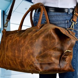 Nouveau Sac de Voyage Unisexe Élégant en Cuir Véritable Imperméable Style Vintage avec Roulettes, Fermeture Éclair et Caractéristique Pliable - Product Image 1