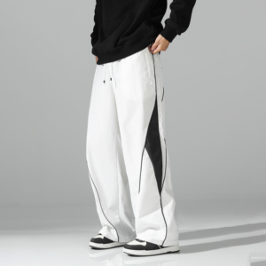 Pantalon de survêtement blanc surdimensionné pour homme, coupe large, avec empiècements latéraux contrastants noirs et détails de passepoil, taille à cordon de serrage – Vente en gros personnalisée - Product Image 1