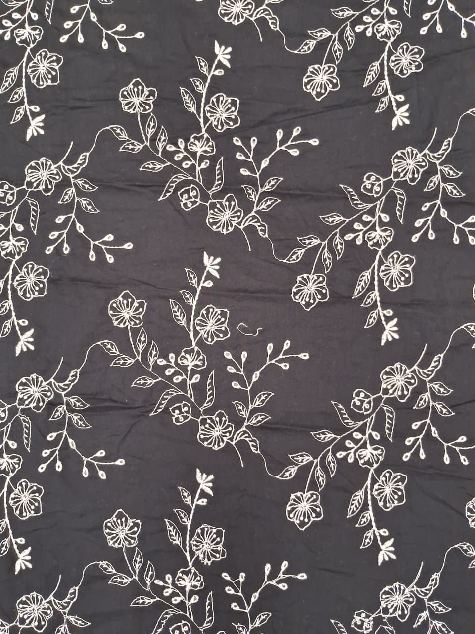 Black base with white embroidery