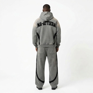 Conjunto deportivo de dos piezas para hombre, con sudadera con capucha gris con cremallera y bloques de color, y pantalones deportivos de pierna ancha. - Product Image 2