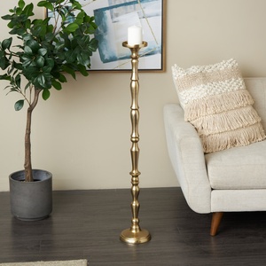 Elegant <b>Tall</b> Gold Pillar <b>Candle</b> Holder Featuring a Classic Spindle Style Stem Durable Metal With Refined Matte Gold Finish - Product Image 1