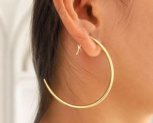 SOUMYA CREATIONS Boucles d'oreilles créoles en laiton plaqué or pour femme - Bijoux de fête tendance du Rajasthan pour tous - Product Image 1
