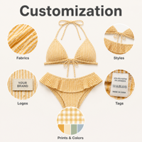 Ensemble de bikini triangle pour femme en Spandex et Polyester, à rayures orange et blanches, avec haut à nouer sur le devant et bas froncé coupe coquine, maillot de bain très élastique
