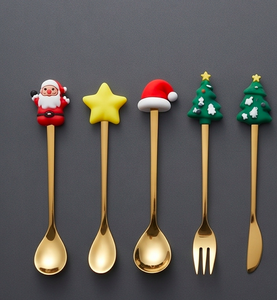 Juego de cubiertos dorados con diseños de dibujos animados, con temática navideña, perfecto para fiestas y uso doméstico. - Product Image 1