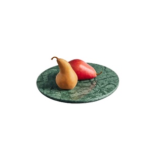 Élégant plateau rond en marbre vert avec veinage frappant parfait pour servir ou comme pièce décorative ajoute une touche audacieuse mais de luxe - Product Image 1
