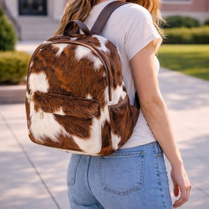 Luxury handmade cowhide leather hair on school <b>backpacks</b> wholesale supplier OEM custom export student bags in affordable price - Product Image 1