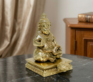 รูปปั้นคูเบอร์ชุบทองเหลืองจาก Jaipur Metals |   รูปปั้นเทพเจ้าฮินดูทองเหลืองแท้ 100% |   5.5 x 5.5 x 9 ซม. |   150 กรัม |   พูจามงคลและมอบของขวัญ - Product Image 1