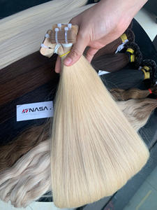 Vente en gros d'extensions de cheveux vietnamiens vierges 100% Tapr 60cm cheveux bruts super doublement étirés en couleur naturelle - Product Image 2