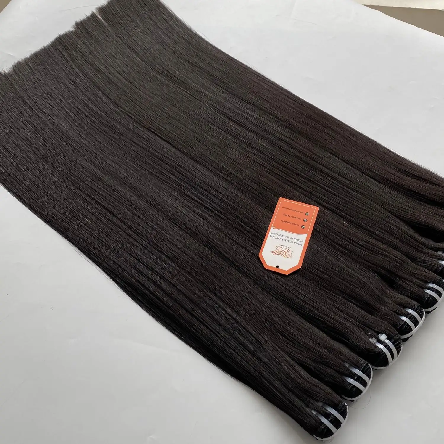 Nero naturale di alta qualità tessuto grezzo non trasformato in osso liscio veri capelli umani all'ingrosso vietnamita fornitore