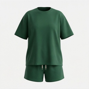 Ensemble décontracté 2 pièces pour femme en coton tricoté vert uni : T-shirt à manches courtes et short au-dessus du genou, coupe ample, idéal printemps-été - Product Image 1