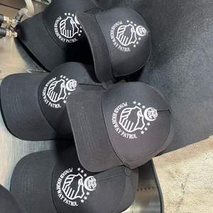 This is a brown crocodile-embossed leather Caps - Product Image 6