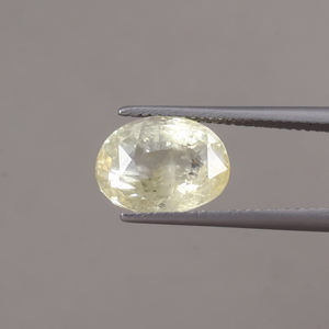 พลอยแซฟไฟร์สีเหลืองทรงรีขนาด 12x9 มม. น้ำหนัก 6.72 กะรัต ได้รับการรับรองจาก IGI แท้ 100% ผ่านการเคลือบแว็กซ์/น้ำมัน  สามารถเปลี่ยนสีได้ - Product Image 1