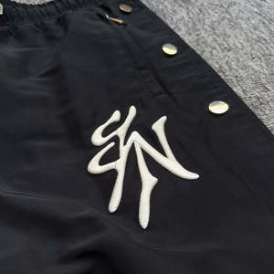 Pantalon de survêtement large pour homme avec fermeture éclair latérale, coupe ample, style hip-hop streetwear, en nylon, pour l'entraînement - Product Image 4