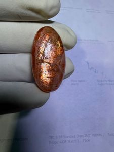 พลอยซันสโตนสีส้มธรรมชาติทรงหลังเบี้ย ประกายทองและเปลี่ยนสีได้ เหมาะสำหรับแหวน จี้ และงานออกแบบเครื่องประดับระดับพรีเมียม - Product Image 3