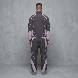 Ensemble de survêtement en nylon pour homme, personnalisé OEM/ODM, avec veste zippée et pantalon large, empiècements contrastants, style streetwear – Fabricant de vêtements sur mesure - Product Image 6
