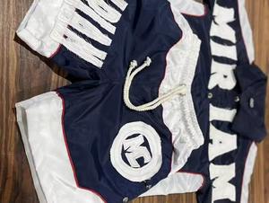 Conjunto Deportivo de Dos Piezas con Logotipo Personalizado Bordado, Chaqueta Cortavientos y Pantalones Cortos de Nailon de Alta Calidad para Hombre - Product Image 2