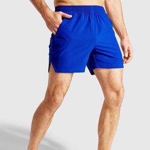 Shorts de sport bleus pour hommes à séchage rapide avec poches, taille élastique, longueur mi-cuisse, couleur unie, en polyester tricoté, pour la course et le fitness - Product Image 2