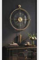 Reloj de pared de lujo con acabado dorado en forma de flecha, ideal para decoración de interiores y regalos, aporta un toque llamativo y un atractivo elegante, procedente de la India.