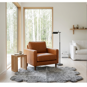 Fauteuil en cuir pour salon scandinave, chaise longue minimaliste nordique, design épuré, mobilier d'intérieur naturel et confortable - Product Image 1