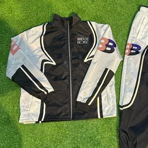 Conjuntos de Chaqueta Cortavientos de Nailon de Alta Calidad 2026, Venta al Por Mayor, Logotipo Personalizado, Conjunto Deportivo Informal de 2 Piezas para Hombre - Product Image 4